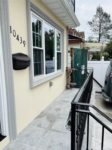 a view of deck with two chair and a window