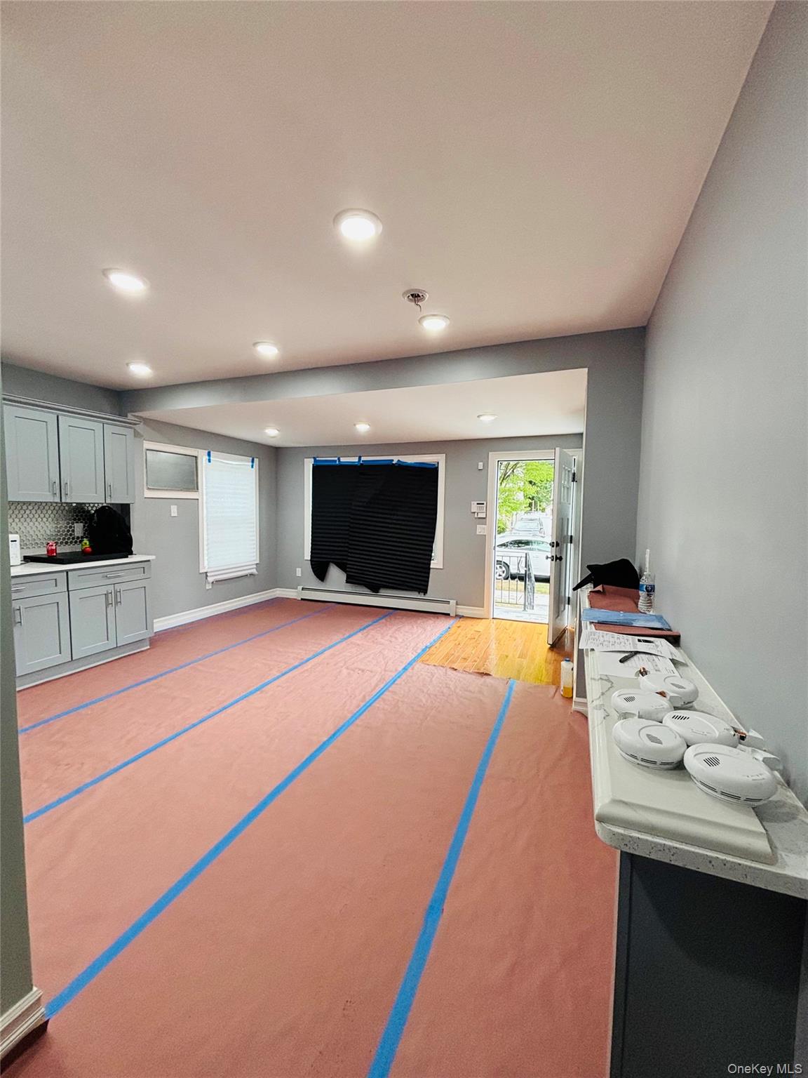 104-39 210th Street Queens, NY 11429 - Photo 4 of 18 a living room with furniture and a flat screen tv