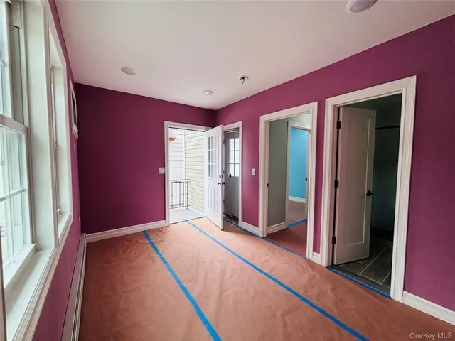 a bathroom with a toilet a sink and shower