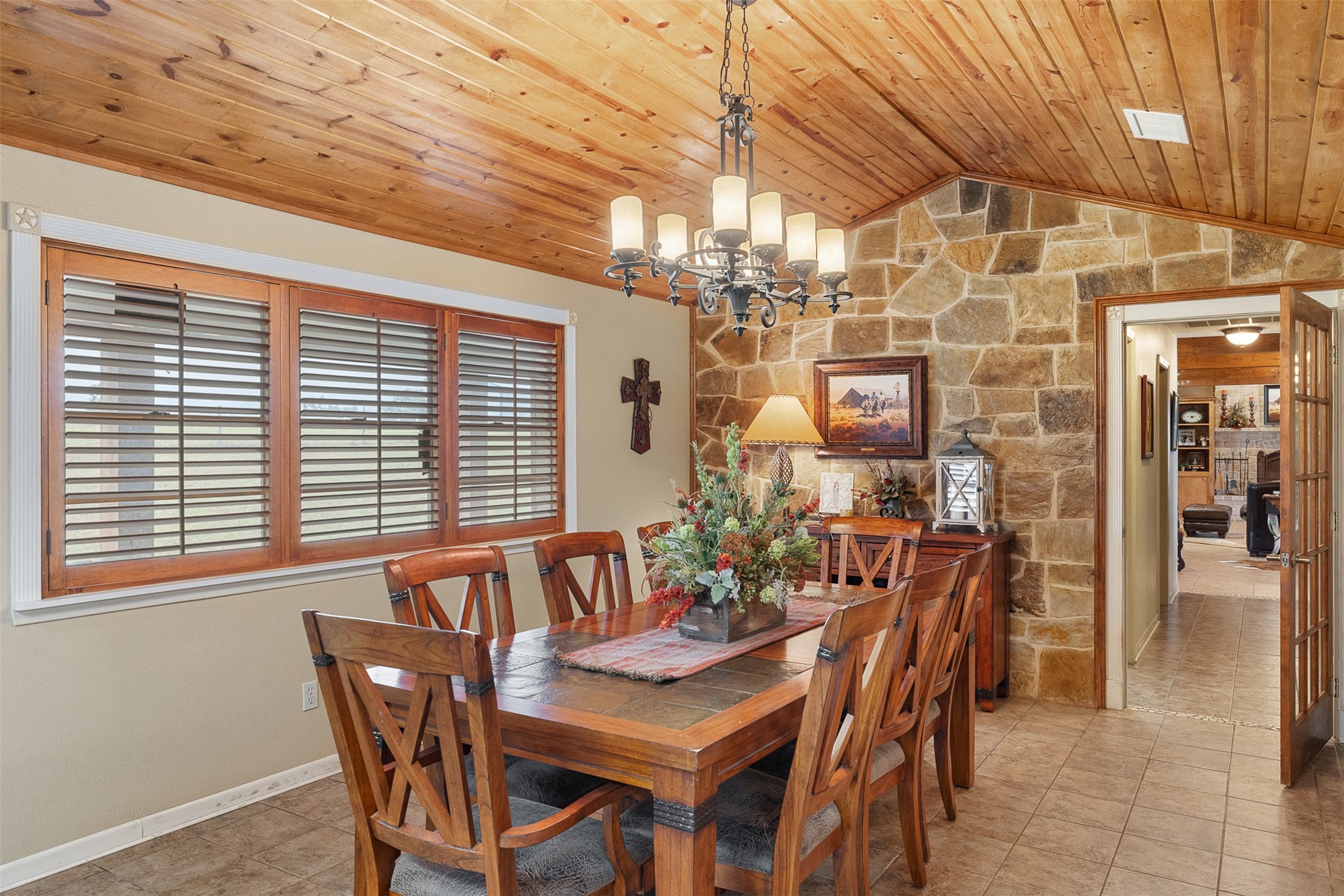 1611 Koy Road Bellville, TX 77418 - Photo 12 of 44 a view of a dining room with furniture and chandelier