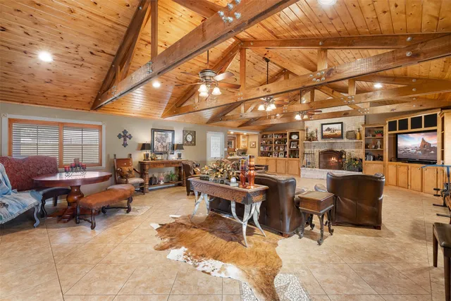 a living room with lots of furniture and a flat screen tv