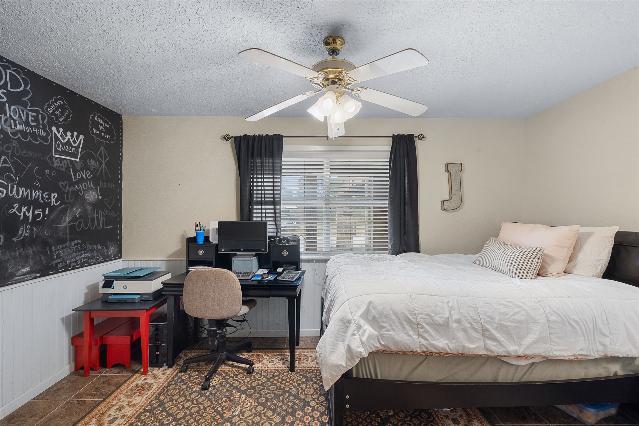 1611 Koy Road Bellville, TX 77418 - Photo 26 of 44 a bedroom with a bed work place window and furniture