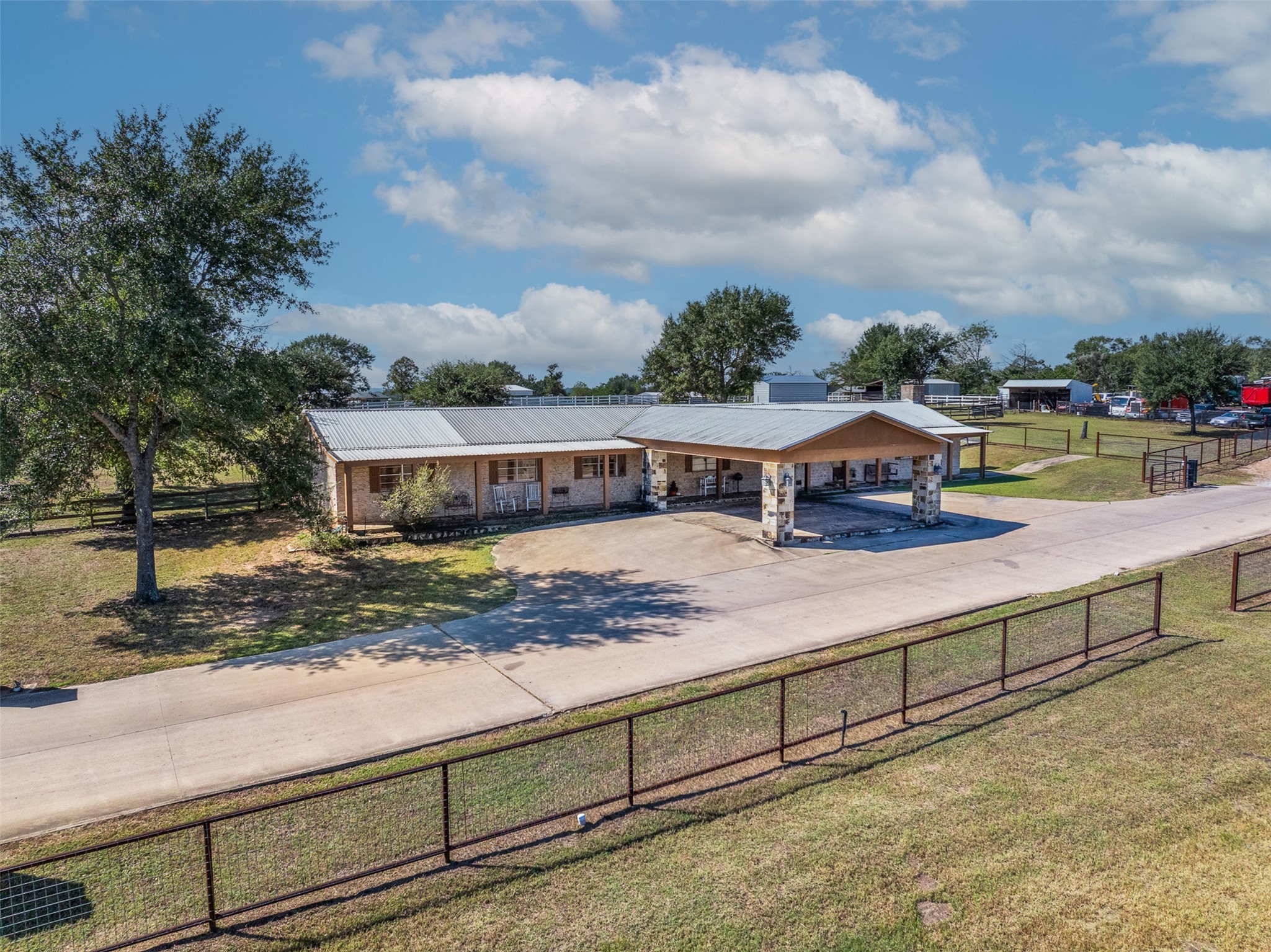 1611 Koy Road Bellville, TX 77418 - Photo 3 of 44 a view of a swimming pool with an outdoor seating