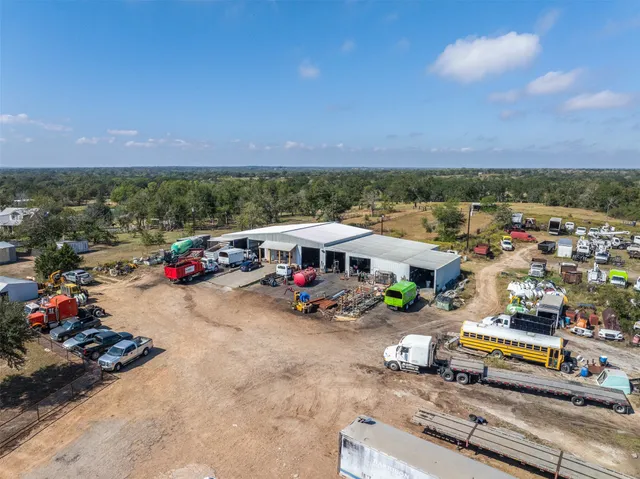 a view of a swimming pool with a yard
