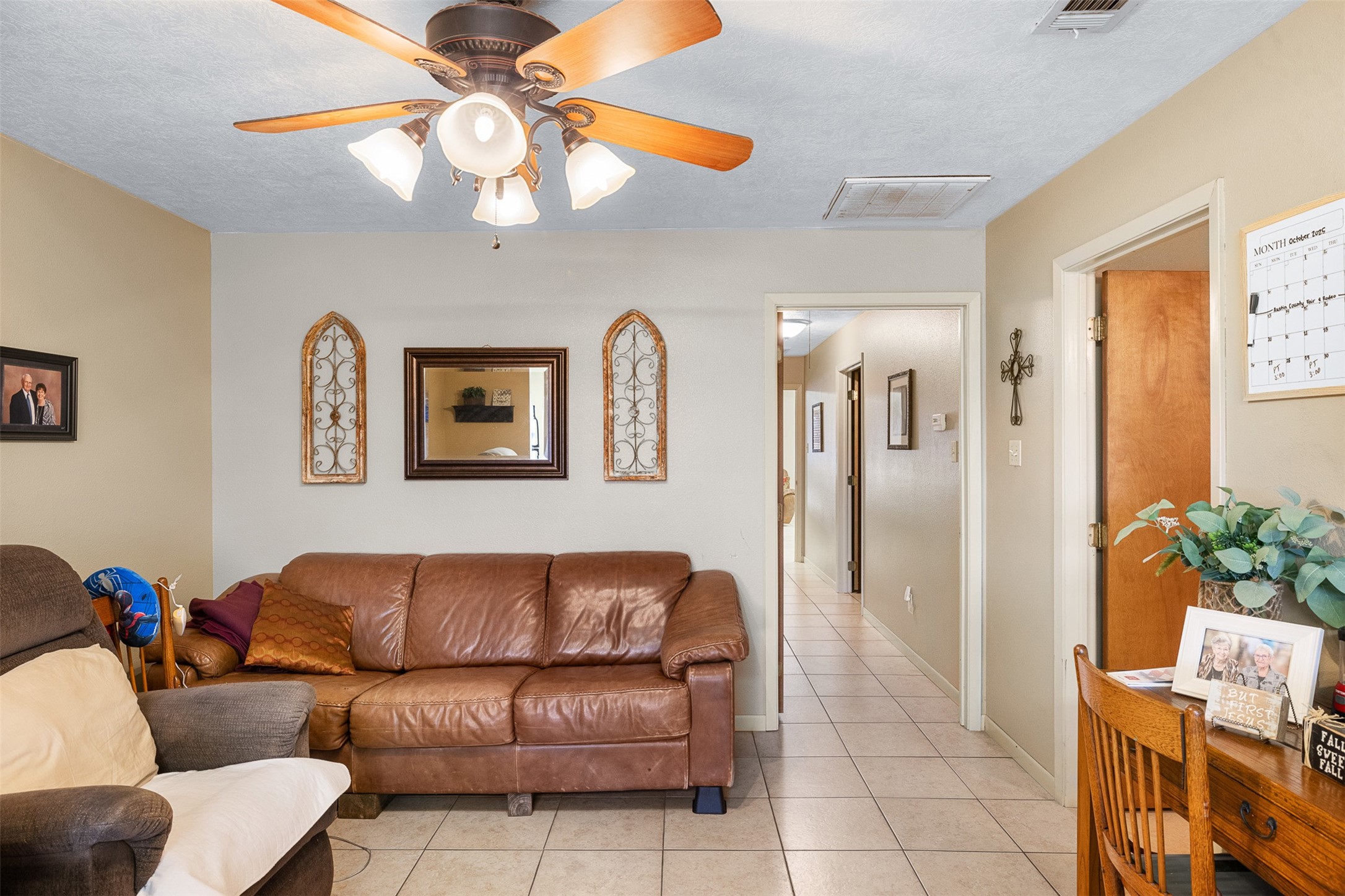 1611 Koy Road Bellville, TX 77418 - Photo 35 of 44 a living room with furniture and a chandelier