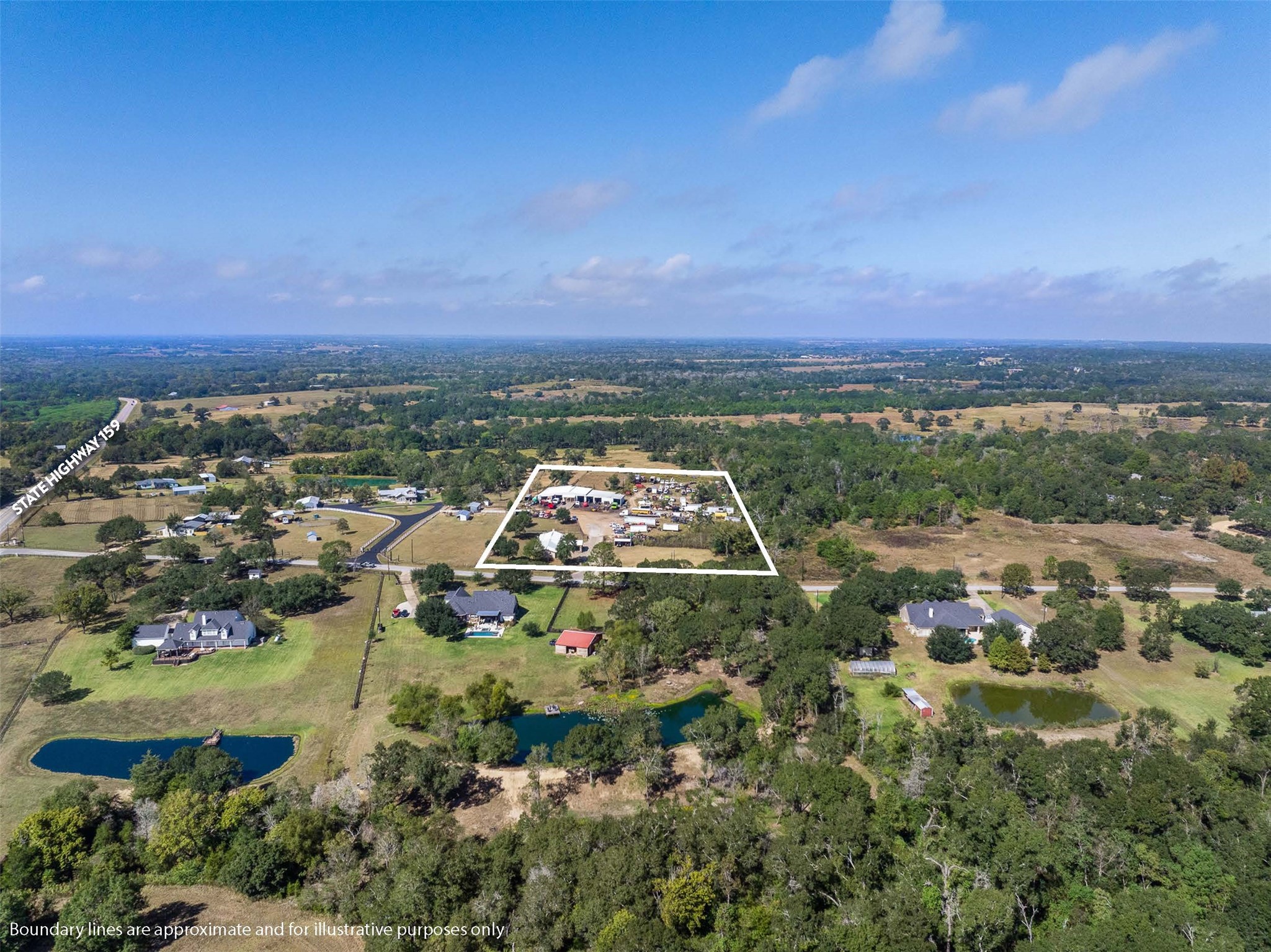1611 Koy Road Bellville, TX 77418 - Photo 39 of 44 an aerial view of residential houses with outdoor space