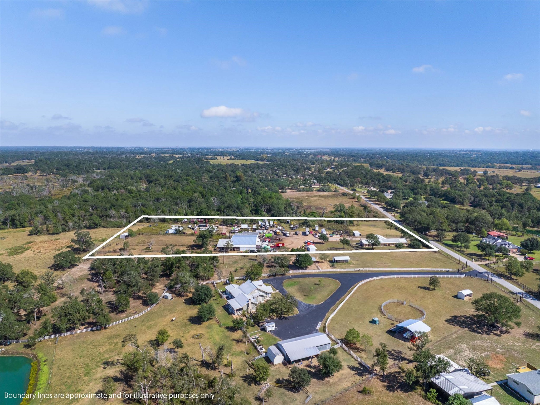 1611 Koy Road Bellville, TX 77418 - Photo 42 of 44 an aerial view of a house with a swimming pool