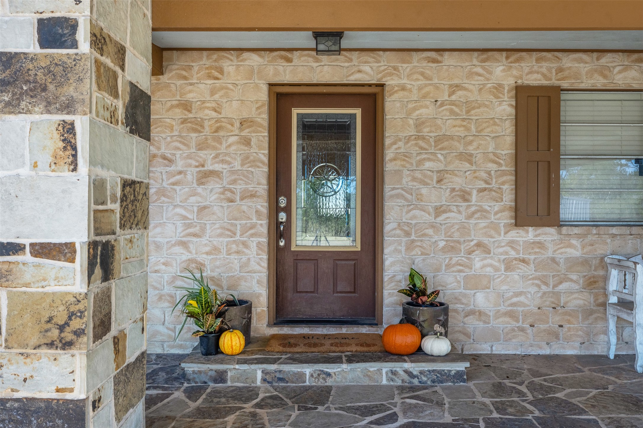 1611 Koy Road Bellville, TX 77418 - Photo 6 of 44 a view of a porch with a table and chairs and potted plants