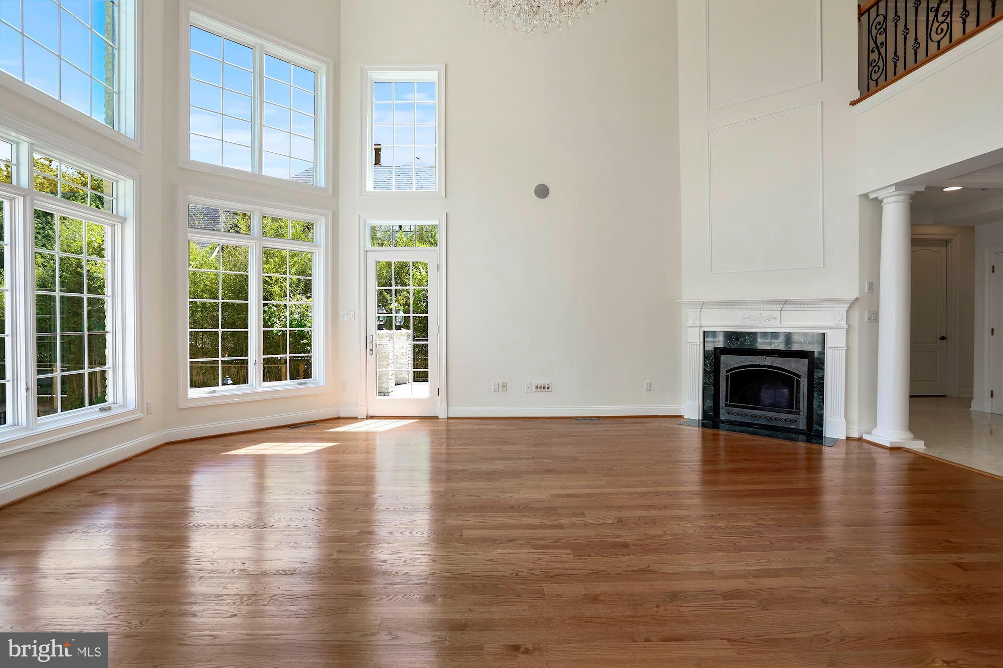 8705 Falls Road Potomac, MD 20854 - Photo 18 of 67 Two-story family room leading to deck
