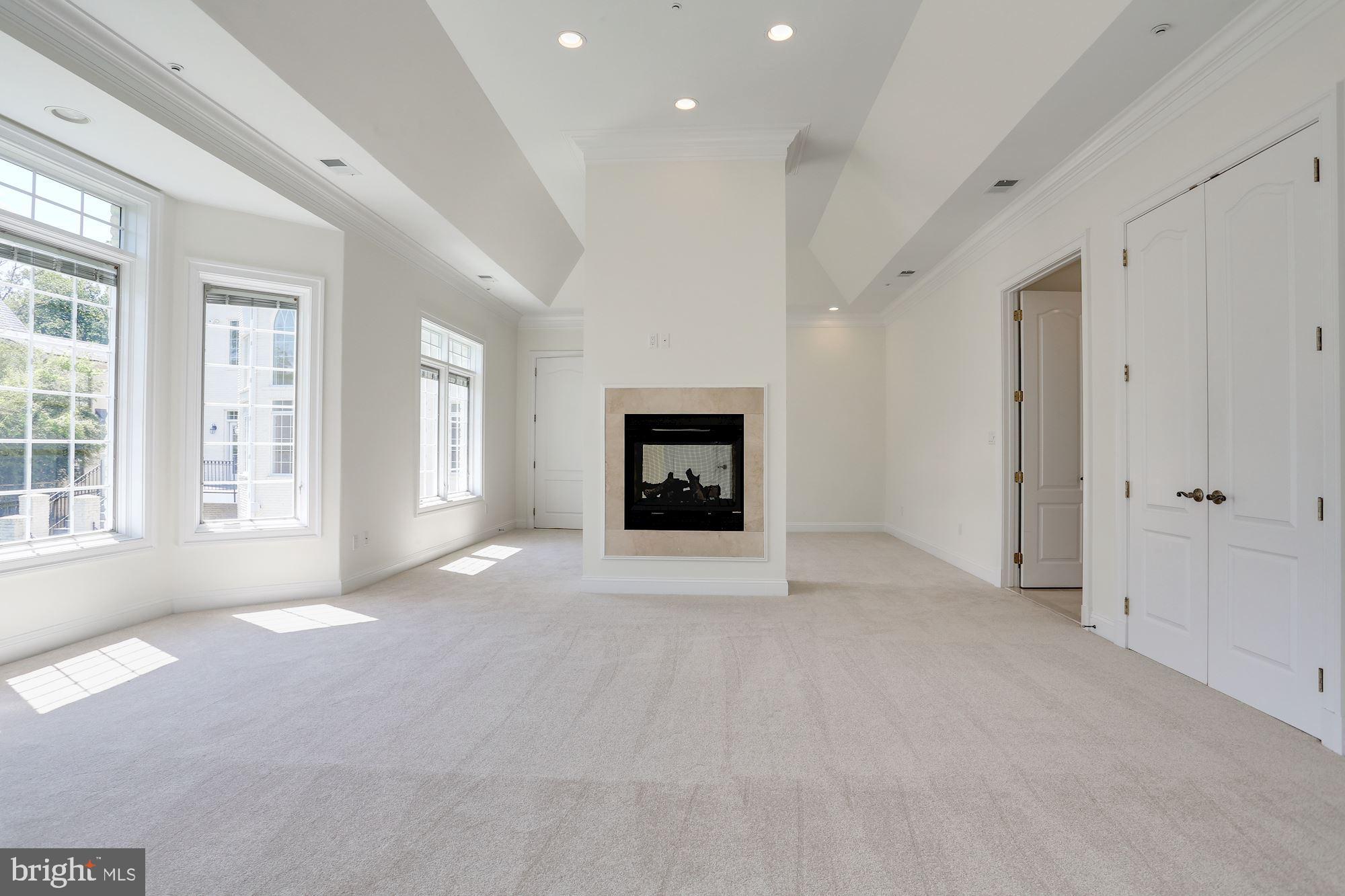8705 Falls Road Potomac, MD 20854 - Photo 24 of 67 Main level master suite with dual-sided fireplace