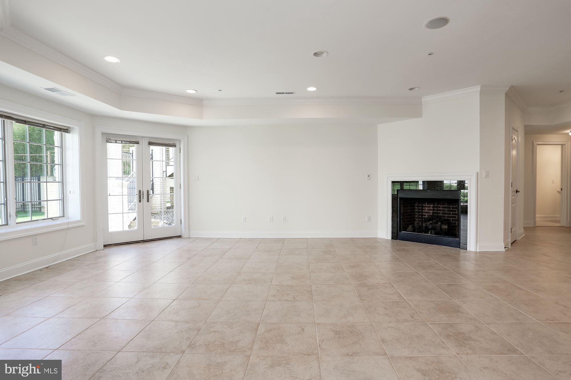 8705 Falls Road Potomac, MD 20854 - Photo 52 of 67 Lower lvl recreation room leading to rear patio