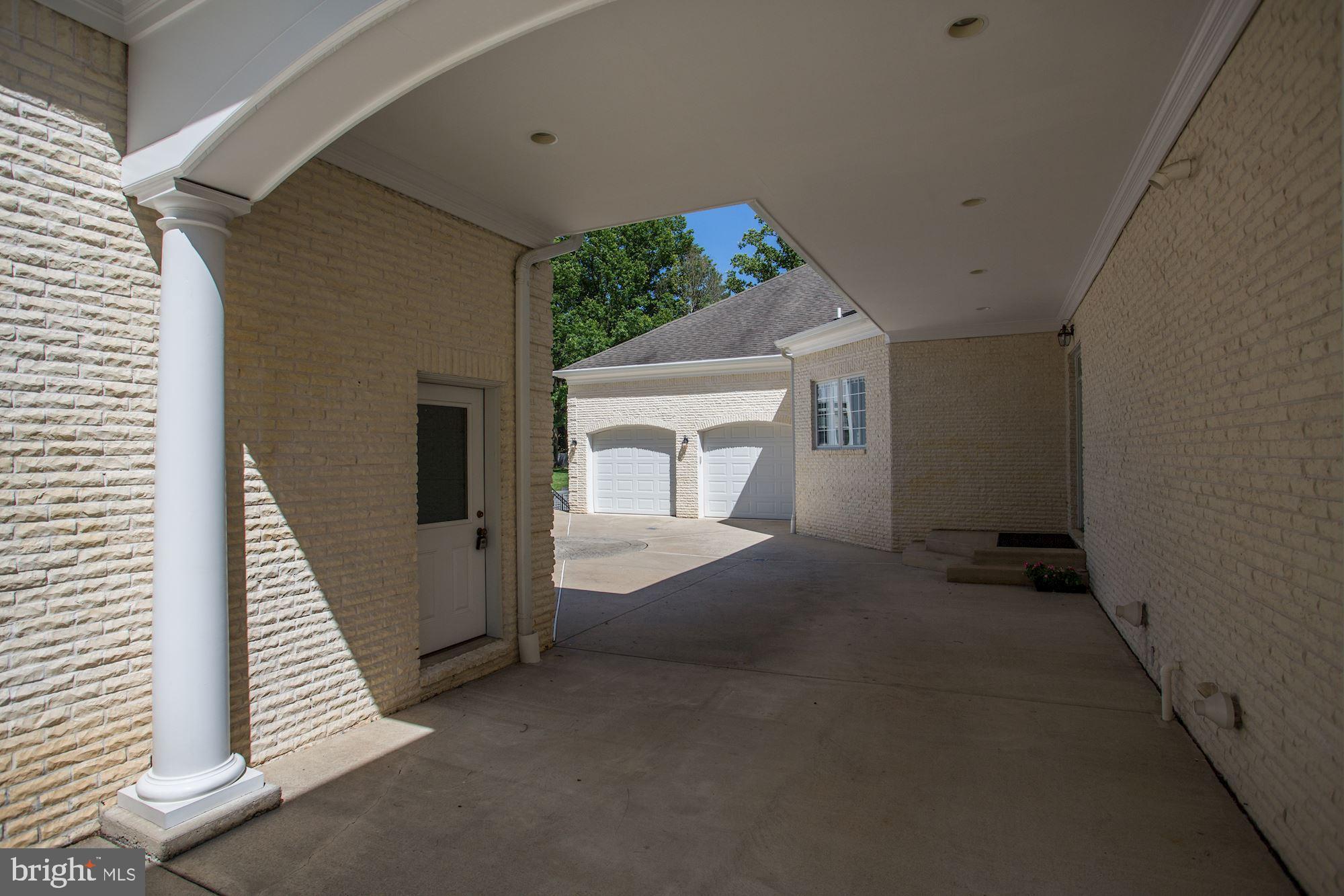 8705 Falls Road Potomac, MD 20854 - Photo 56 of 67 Detached garage, courtyard and porch to kitchen