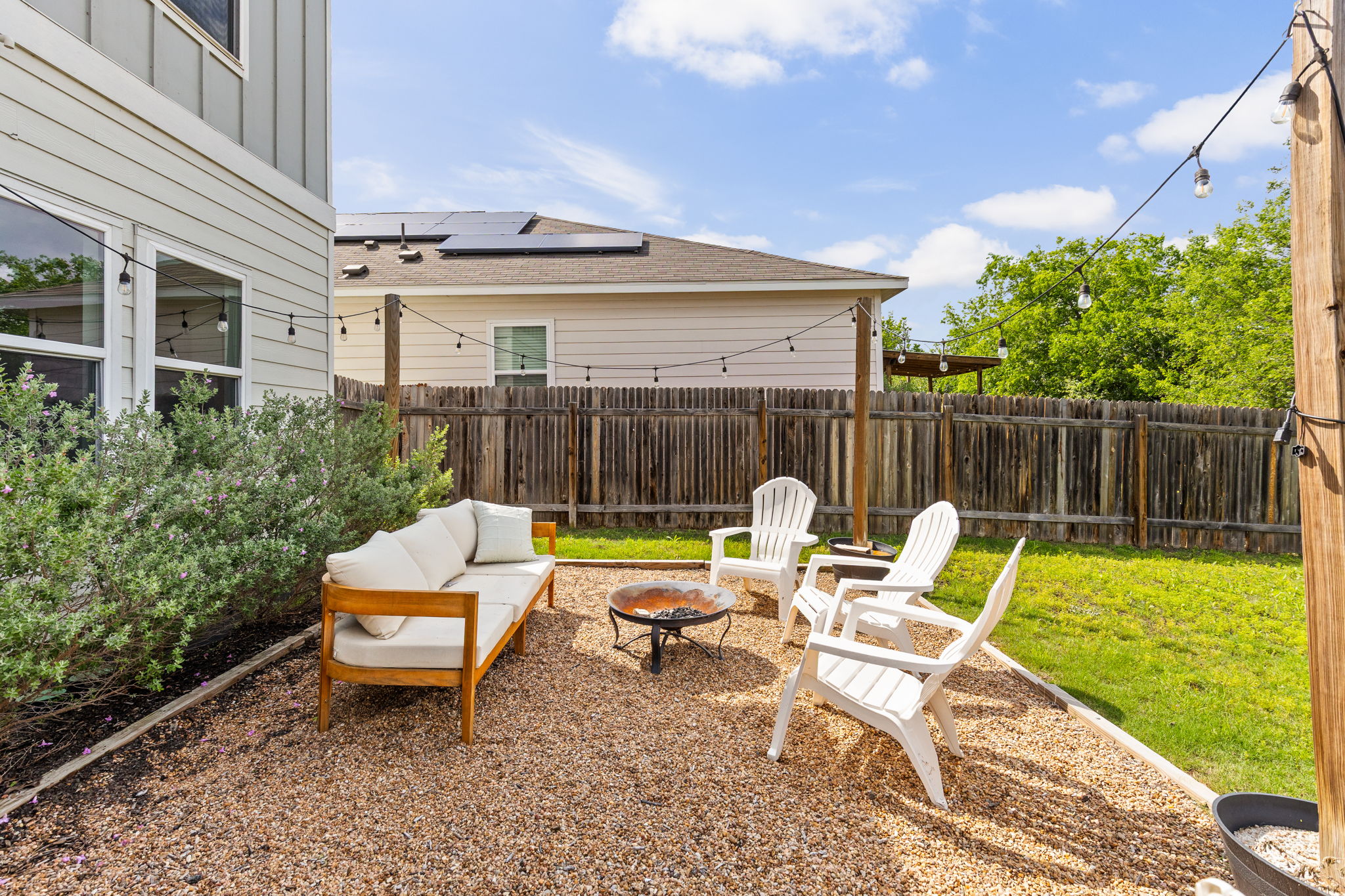 6702 Routenburn Street Austin, TX 78754 - Photo 19 of 24 a view of a patio with a chairs and table in a patio