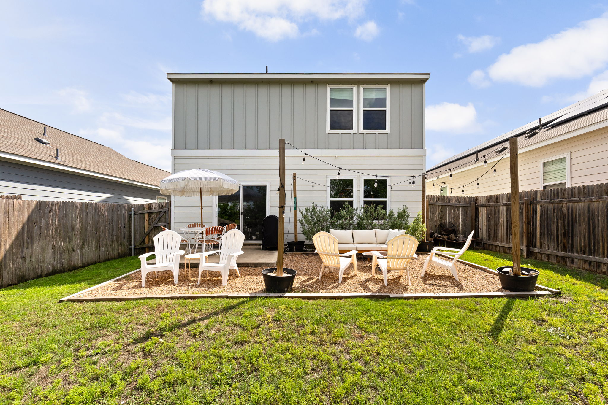 6702 Routenburn Street Austin, TX 78754 - Photo 21 of 24 a view of a patio with table and chairs and potted plants