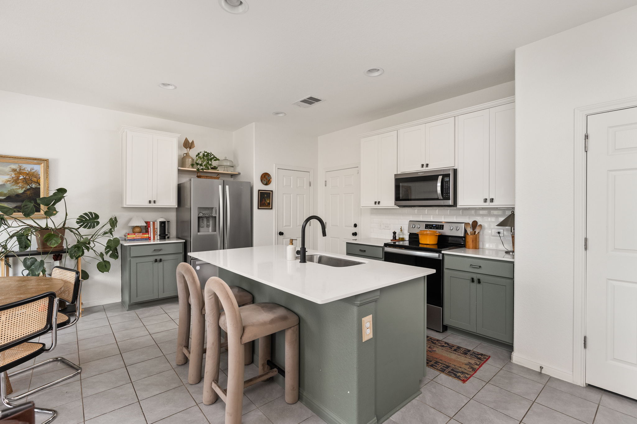 6702 Routenburn Street Austin, TX 78754 - Photo 7 of 24 a kitchen with refrigerator and cabinets
