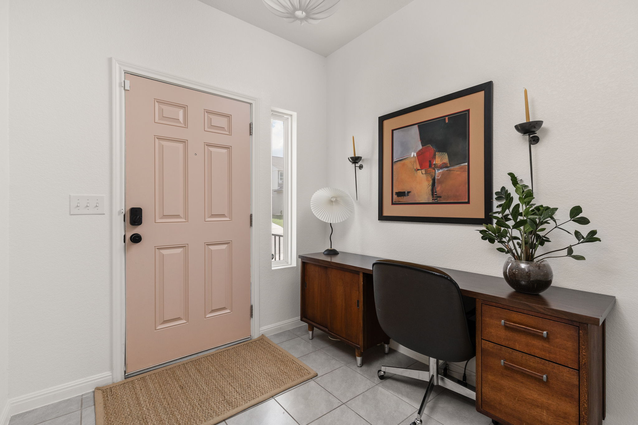 6702 Routenburn Street Austin, TX 78754 - Photo 9 of 24 a view of a workspace room with painting on the wall and a potted plant