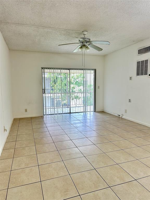 640 Northwest 13th Street, Unit 26 Boca Raton, FL 33486 - Photo 2 of 11 a view of an empty room with a window