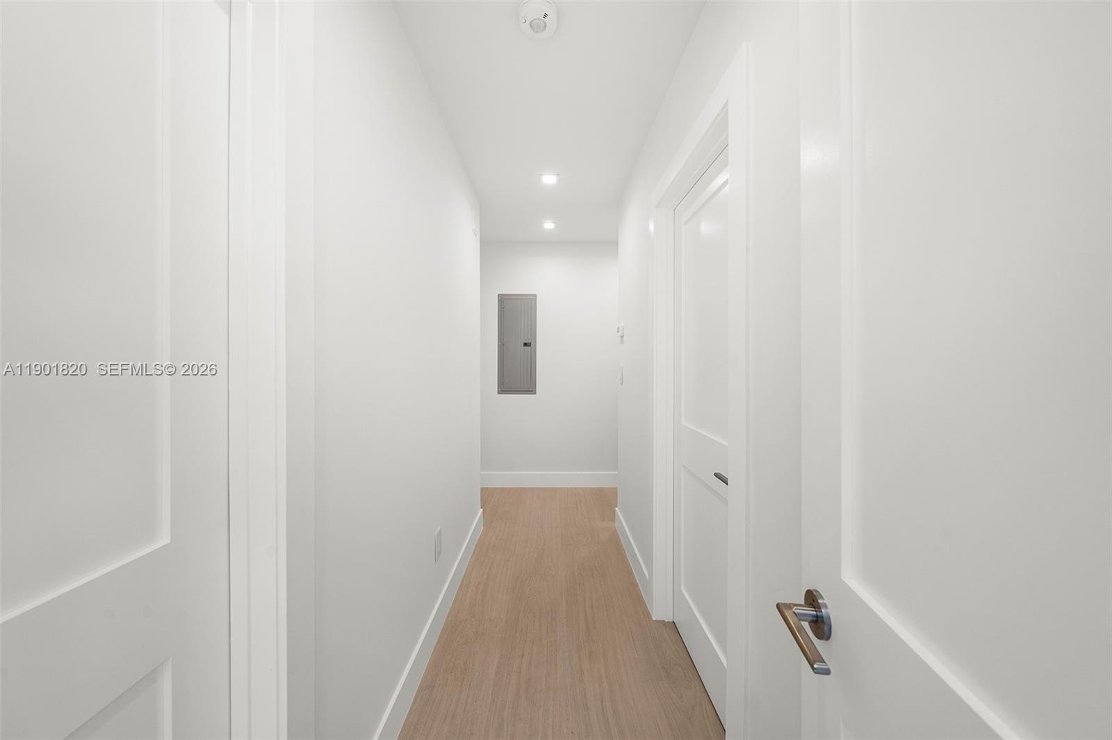 10945 Southwest 75th Court Pinecrest, FL 33156 - Photo 28 of 81 First Hallway to Bedroom on the left, and powder room on the right.