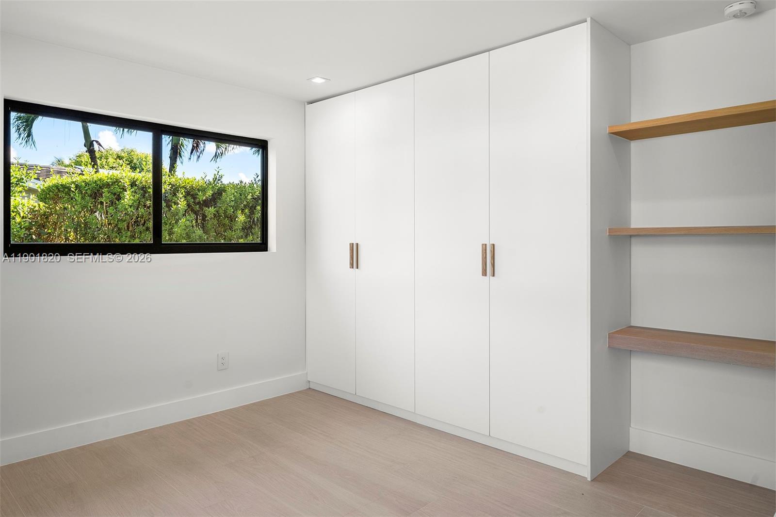 10945 Southwest 75th Court Pinecrest, FL 33156 - Photo 38 of 81 Second Bedroom - with custom made closets