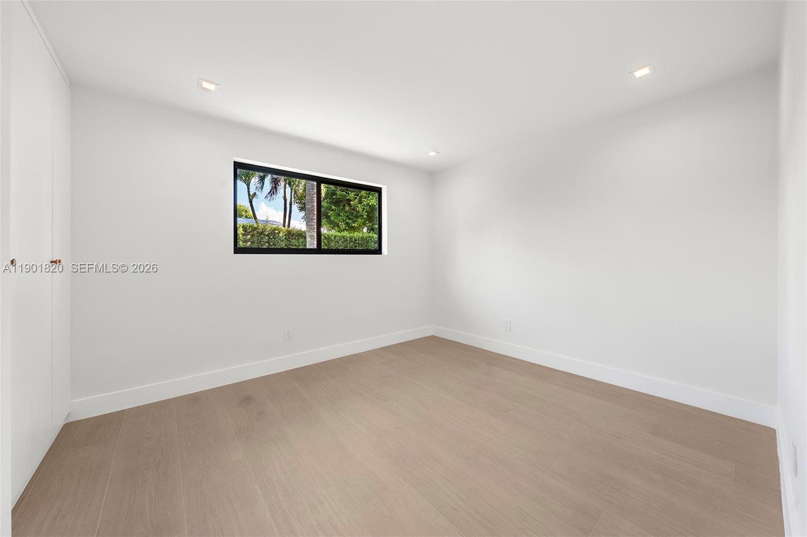 10945 Southwest 75th Court Pinecrest, FL 33156 - Photo 46 of 81 an empty room with a window