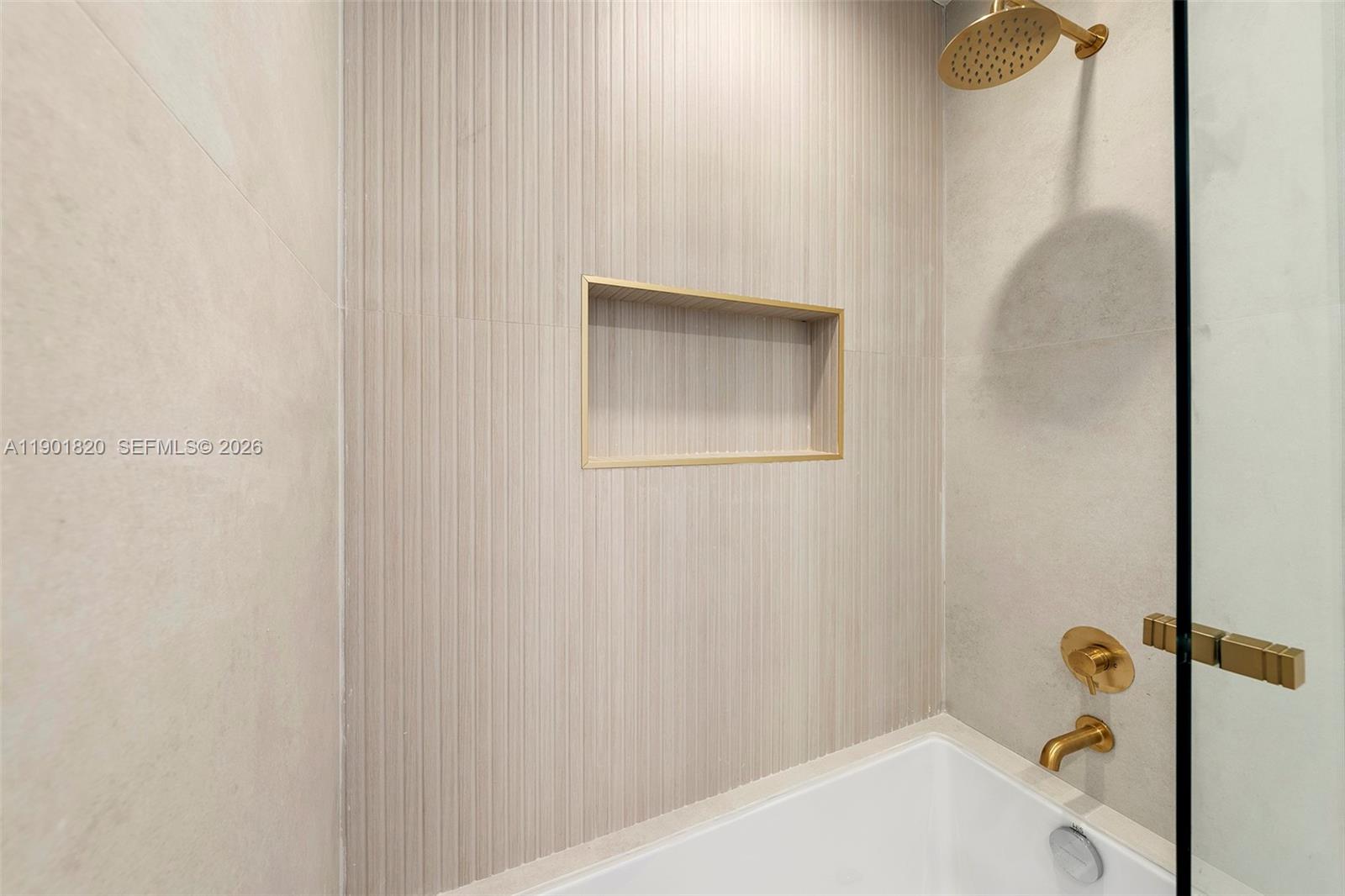 10945 Southwest 75th Court Pinecrest, FL 33156 - Photo 51 of 81 a bathroom with a bathtub