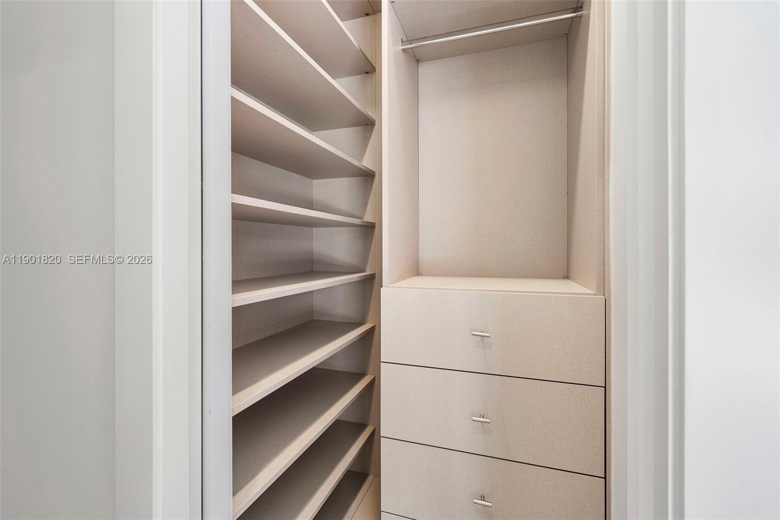 10945 Southwest 75th Court Pinecrest, FL 33156 - Photo 61 of 81 a view of walk in closet with empty racks