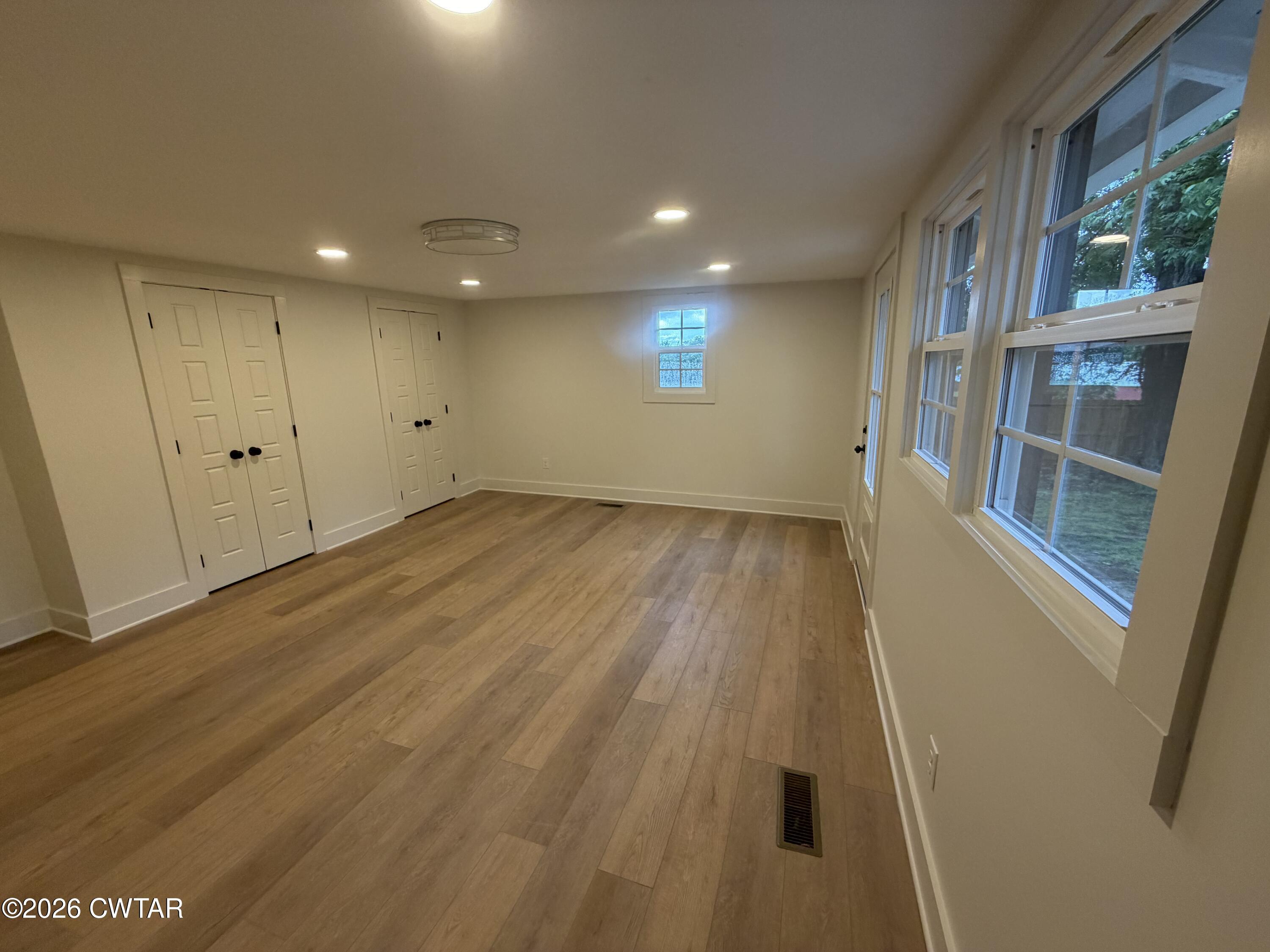 16 Manner Frank Road Milan, TN 38358 - Photo 15 of 25 wooden floor in an empty room with a window