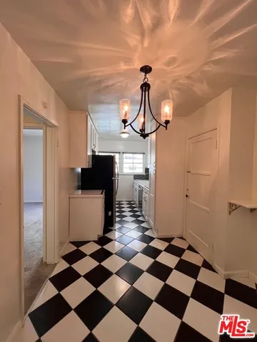 a view of a storage & utility room with a checkered floor