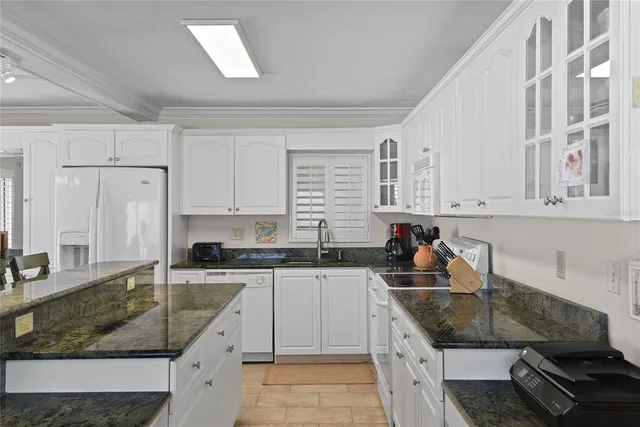 a very nice looking kitchen with a large window