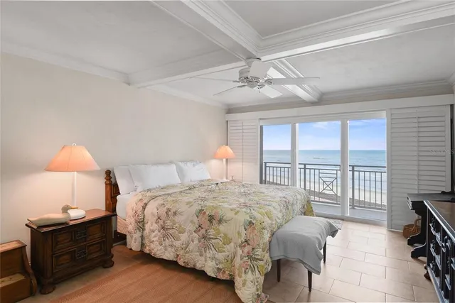 a bedroom with a bed and a table in it