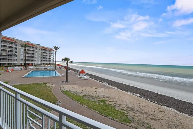 a bedroom with furniture and a lamp