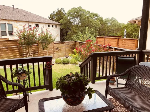 a bathroom with a granite countertop sink mirror and bathtub