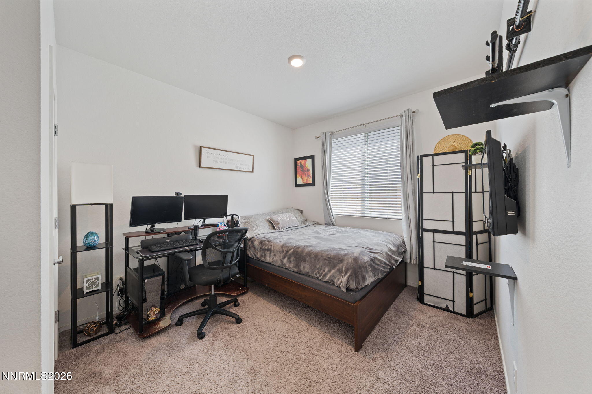 9708 Sea Glass Drive Reno, NV 89506 - Photo 5 of 51 a bedroom with a bed a flat screen tv and dresser