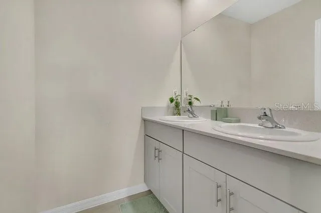 a bathroom with a sink and vanity