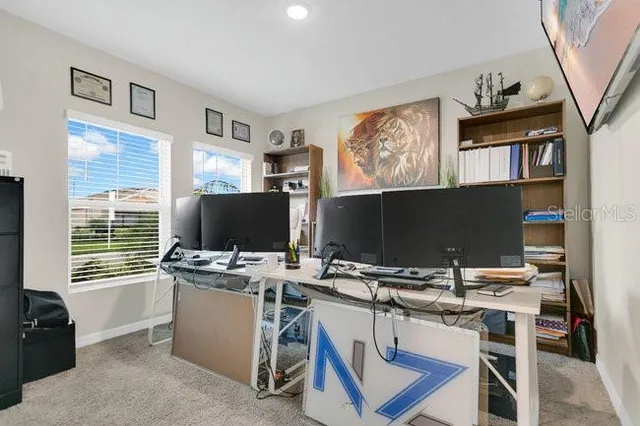 a workspace with furniture and a window