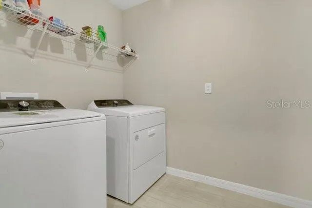 a utility room with dryer and washer