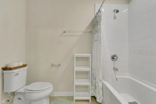 a bathroom with a bathtub and a toilet