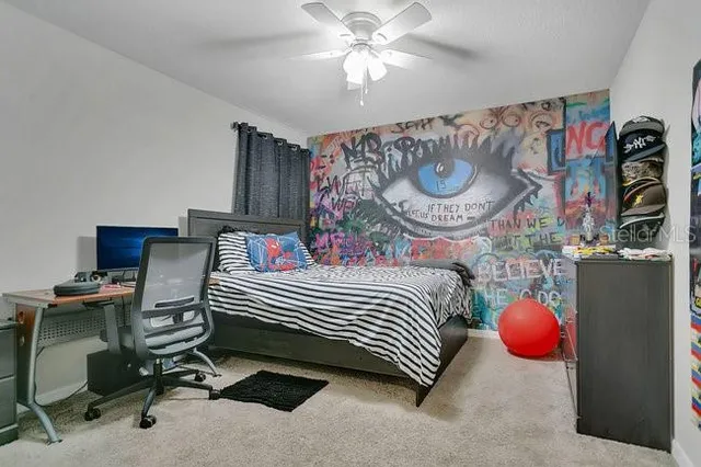 a bedroom with a bed and cabinets