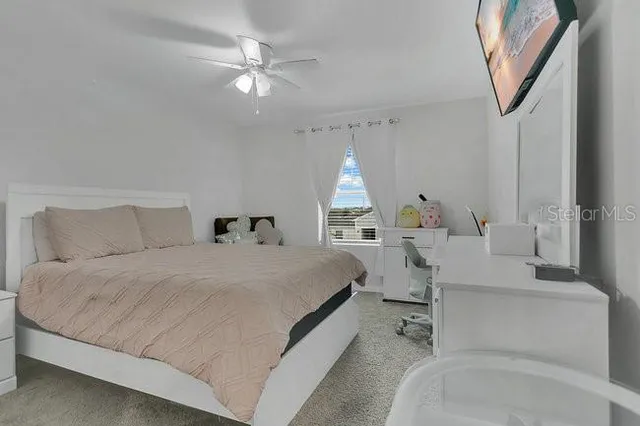 a bed room with a bed and a chandelier