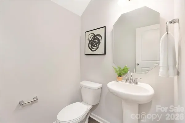 a bedroom with a bed and a chair