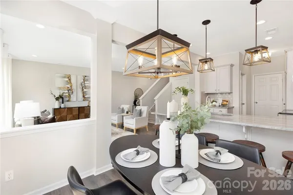 a living room with furniture and white walls