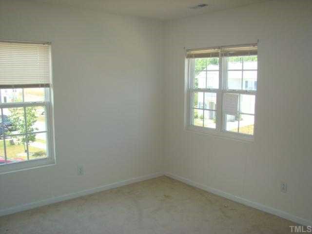 2627 Quarry Springs Road Raleigh, NC 27610 - Photo 9 of 9 an empty room with a window