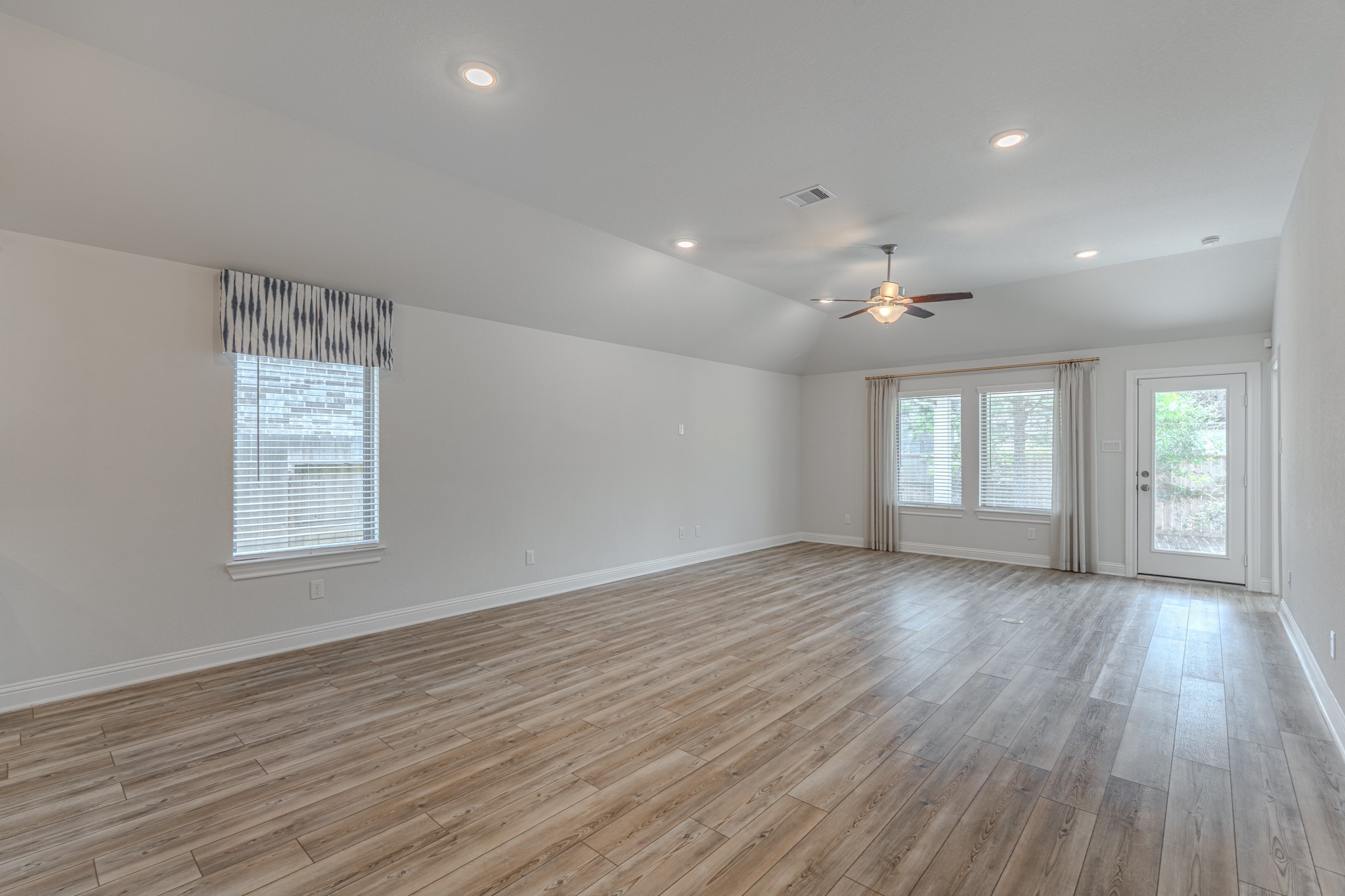 9840 Sweet Flag Court Conroe, TX 77385 - Photo 19 of 50 Open-concept design allows the kitchen, dining, and living areas to flow together effortlessly, creating a warm and welcoming environment.