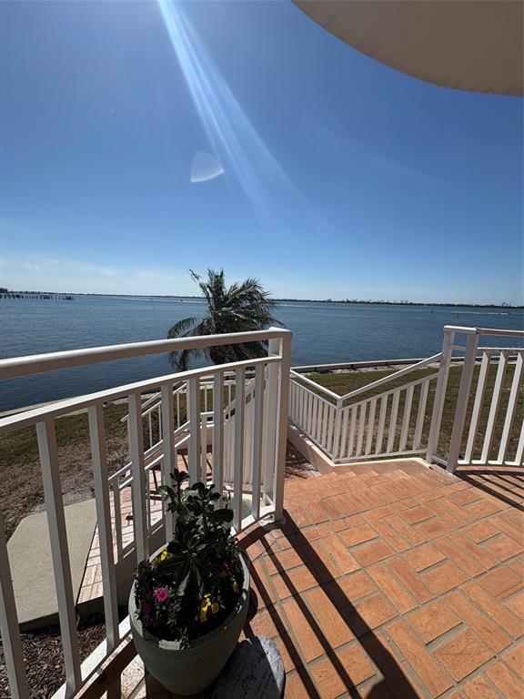 11000 Placida Road, Unit 101 Placida, FL 33946 - Photo 11 of 22 a view of a balcony with chairs