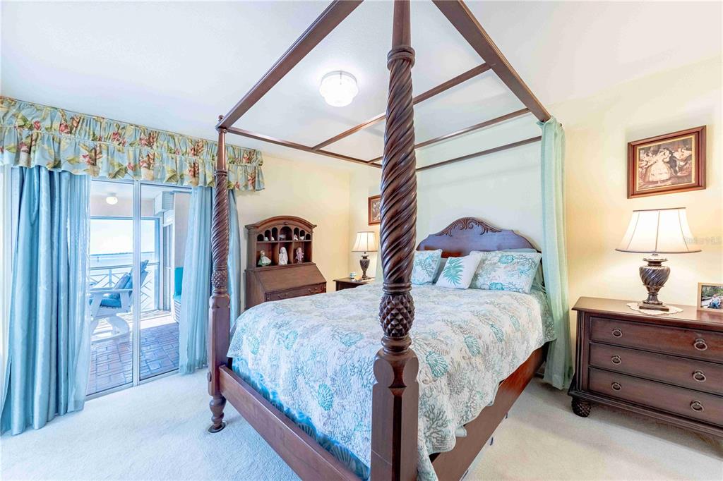 11000 Placida Road, Unit 101 Placida, FL 33946 - Photo 13 of 22 a bedroom with a bed and a painting on the wall