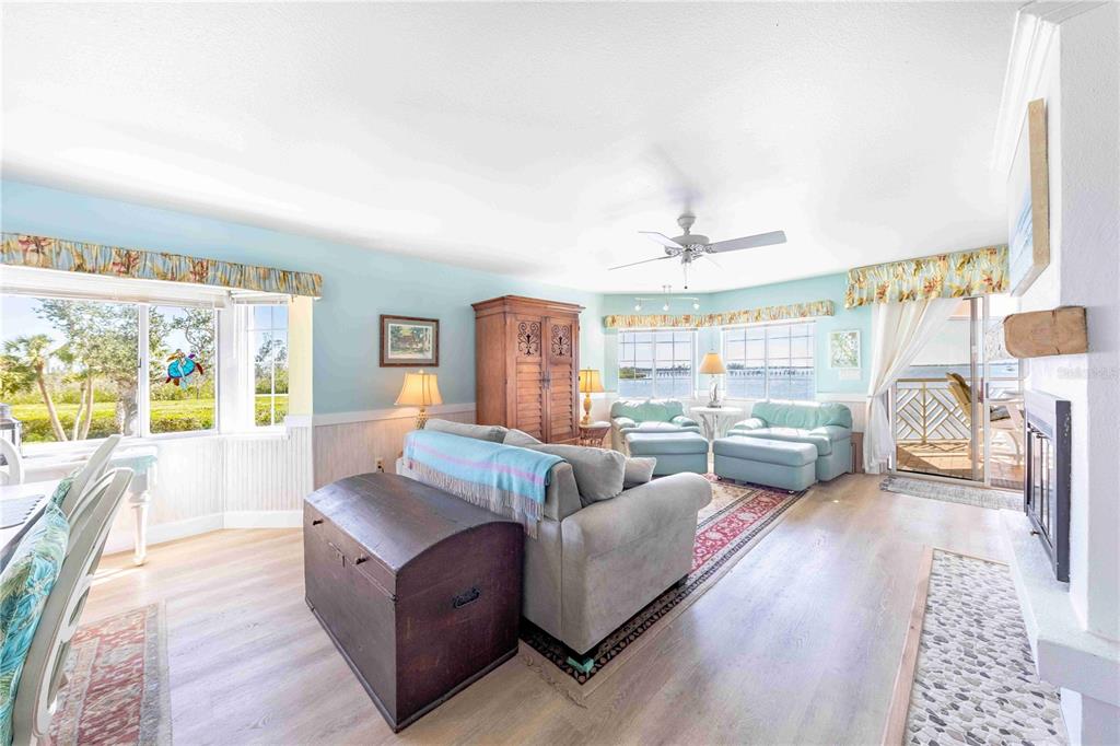 11000 Placida Road, Unit 101 Placida, FL 33946 - Photo 4 of 22 a living room with furniture and a large window