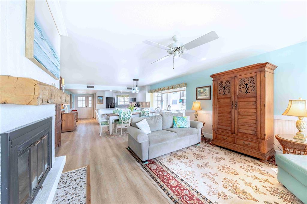 11000 Placida Road, Unit 101 Placida, FL 33946 - Photo 5 of 22 a living room with furniture and wooden floor