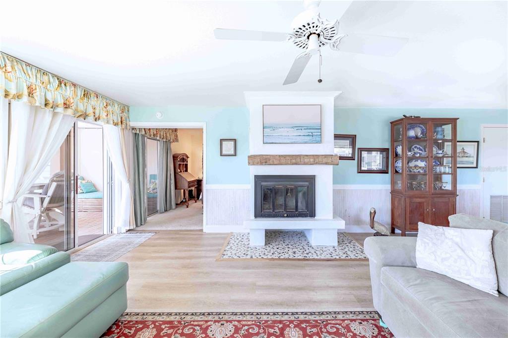 11000 Placida Road, Unit 101 Placida, FL 33946 - Photo 6 of 22 a living room with furniture and a fireplace