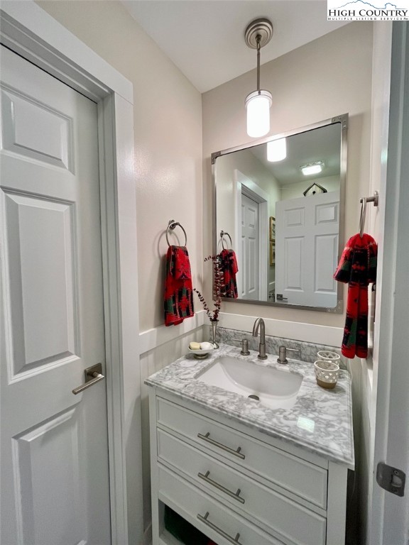 366 Russelton Road Boone, NC 28607 - Photo 13 of 29 a bathroom with a granite countertop sink and a mirror