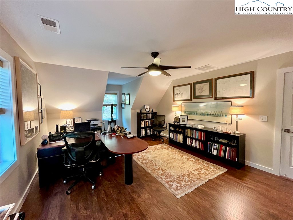 366 Russelton Road Boone, NC 28607 - Photo 20 of 29 a large living room with stainless steel appliances granite countertop a couch wooden floor a rug and a window